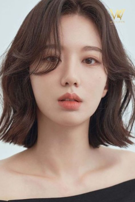 tóc ngắn nữ uốn xoăn lơi